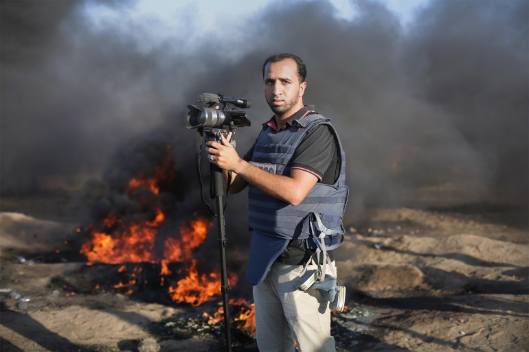 Palestine, Gaza - March, 1,2023:A journalist filming the events of the war between Palestine and Israel, in the middle of the Gaza Strip.
